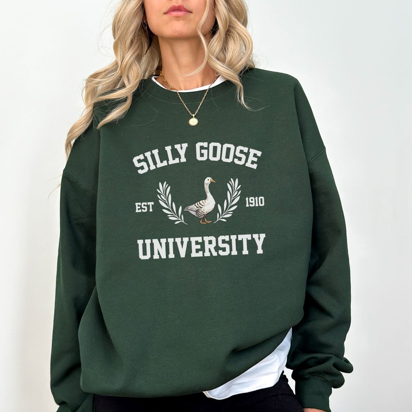 "Silly Goose University" funny graphic sweatshirt, 50% cotton, 50% polyester, available in 9 colors.