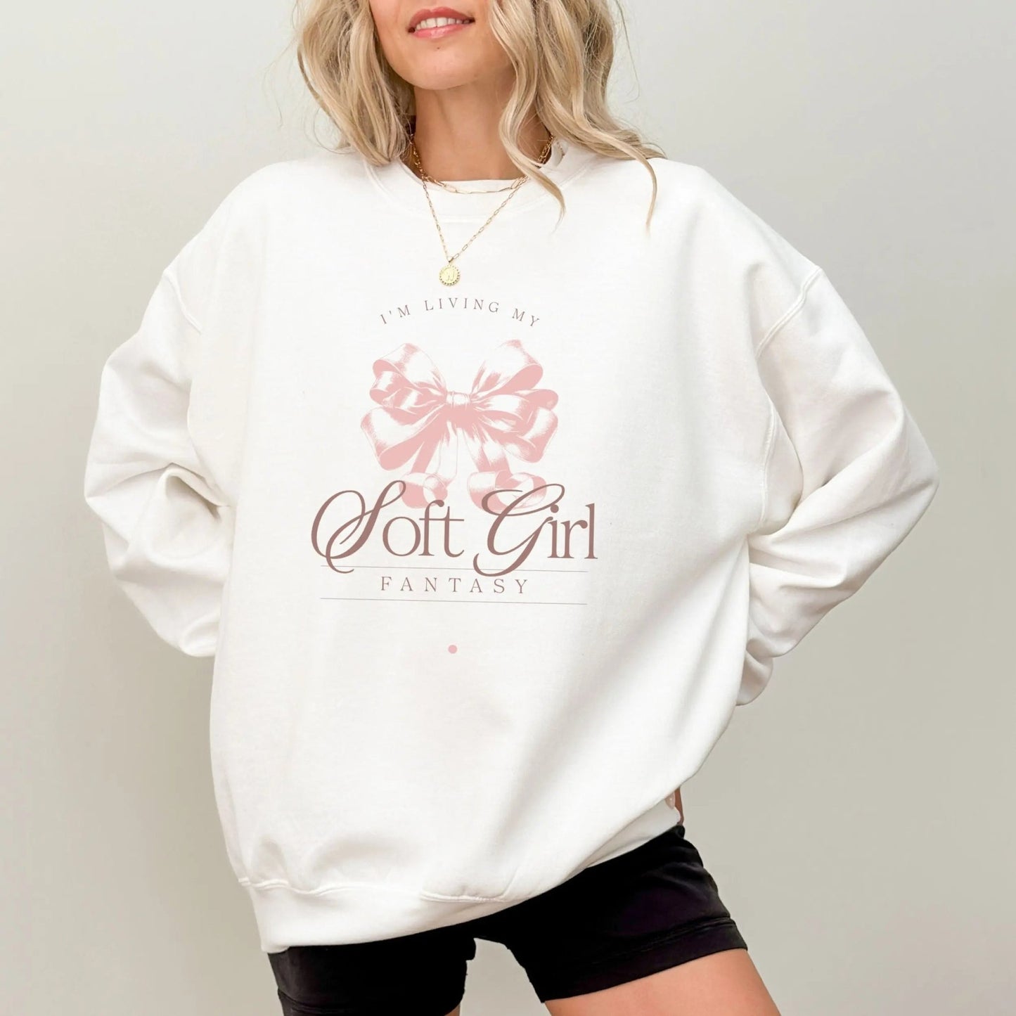 White sweatshirt with Soft Girl Fantasy design and pink bow for coquette style fashion.