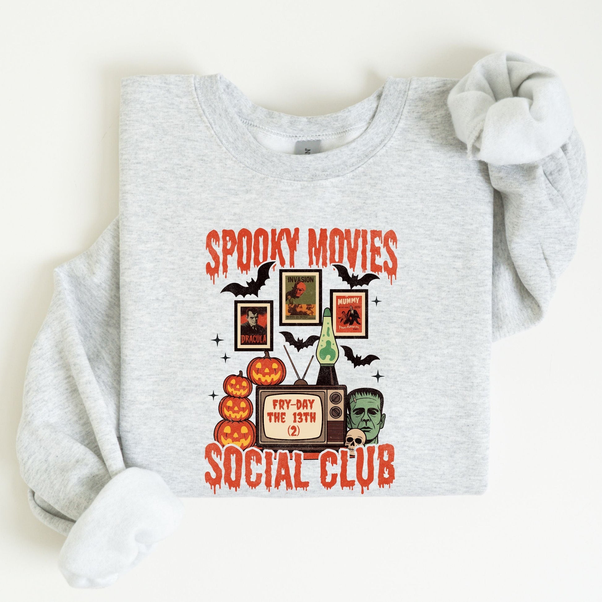 Spooky Movies Social Club Halloween sweatshirt with retro TV, jack-o-lanterns, and Frankenstein design