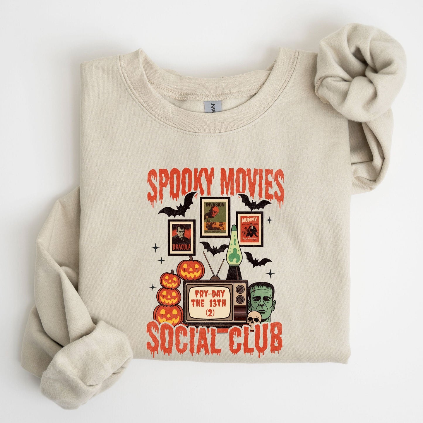 Spooky Movies Social Club Halloween sweatshirt with retro TV, jack-o-lanterns, and Frankenstein design
