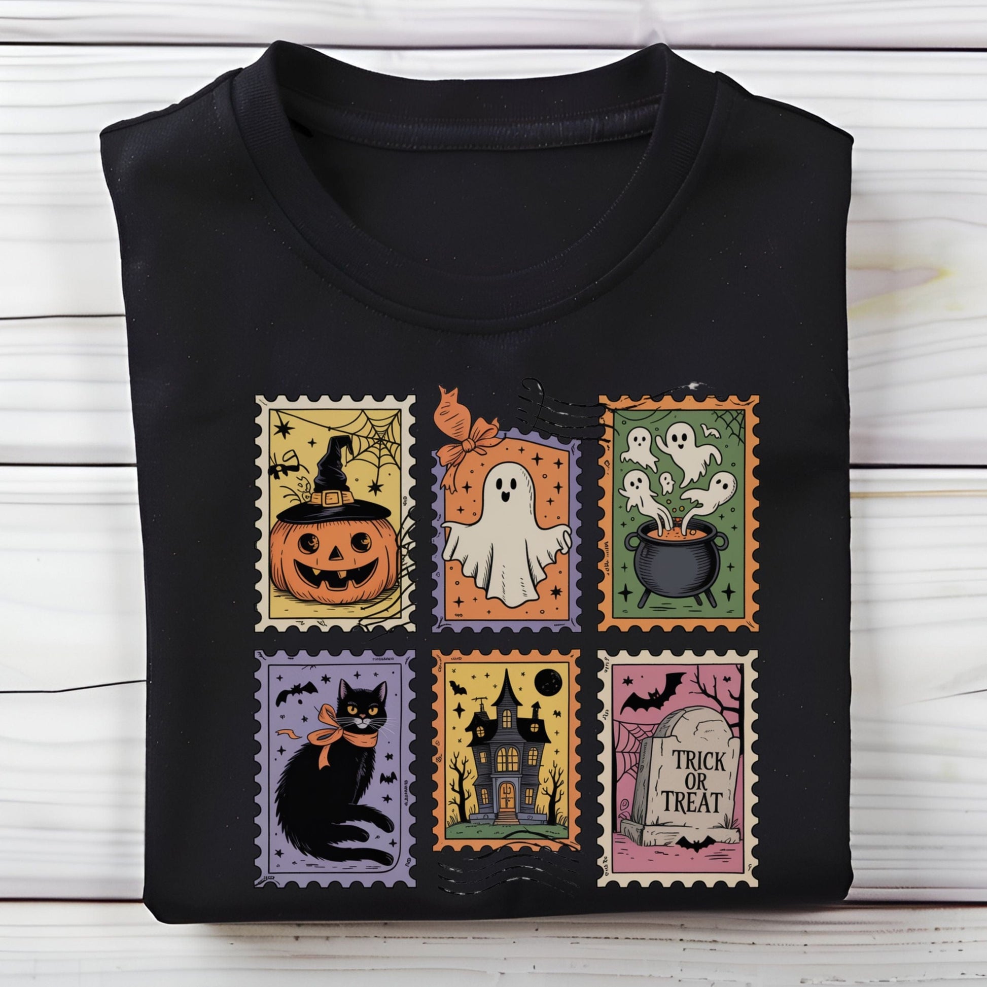 Vintage Halloween t-shirt with postage stamp illustrations of ghosts, pumpkins, black cat, haunted house, and trick-or-treat