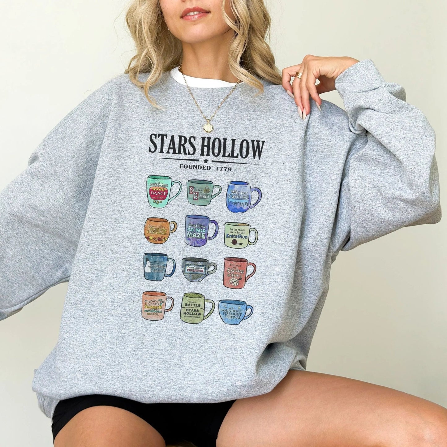 "Stars Hollow Mugs" sweatshirt, cozy town aesthetic, Gilmore Girls merch, 9 colors.