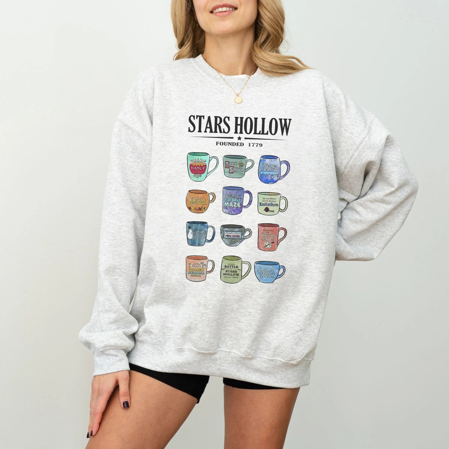 "Stars Hollow Mugs" sweatshirt, cozy town aesthetic, Gilmore Girls merch, 9 colors.