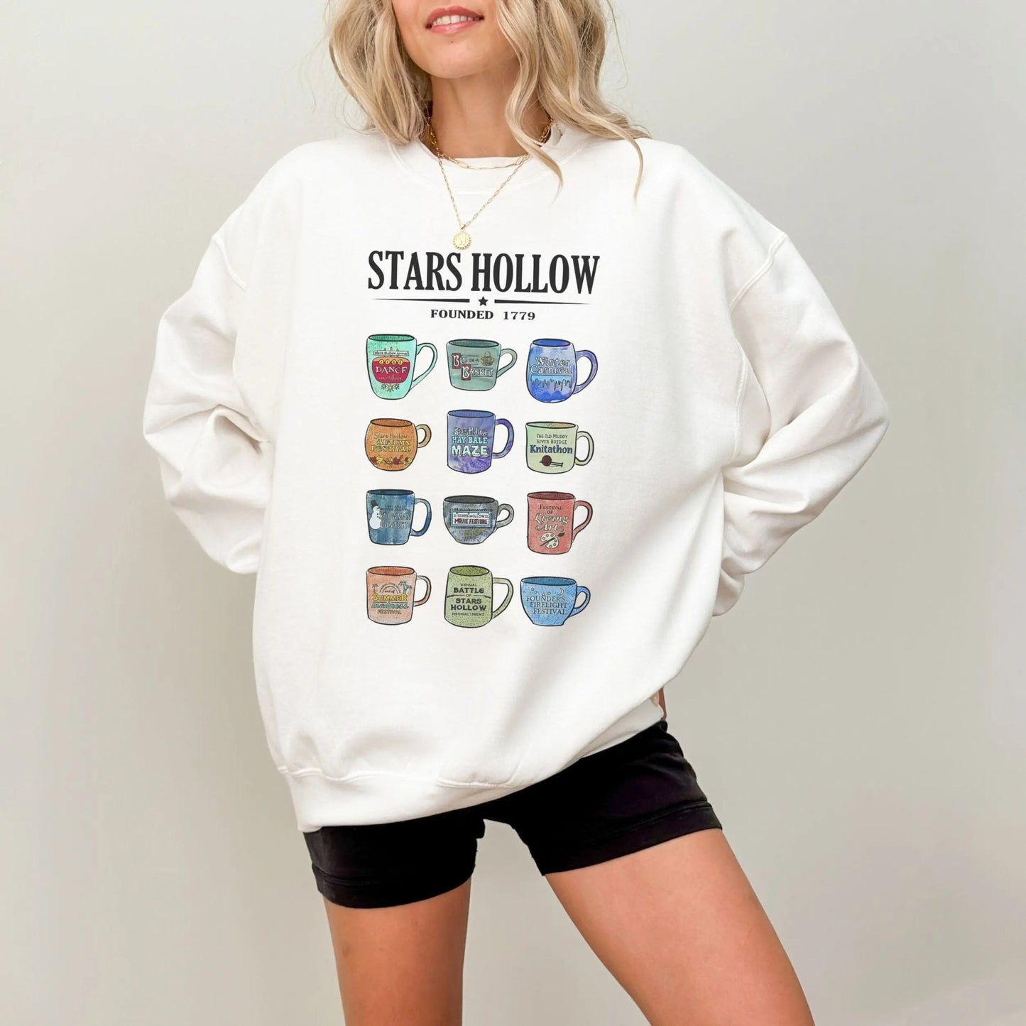 "Stars Hollow Mugs" sweatshirt, cozy town aesthetic, Gilmore Girls merch, 9 colors.