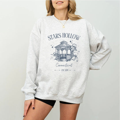 "Stars Hollow" sweatshirt, cozy town aesthetic, Gilmore Girls merch, warm and stylish.