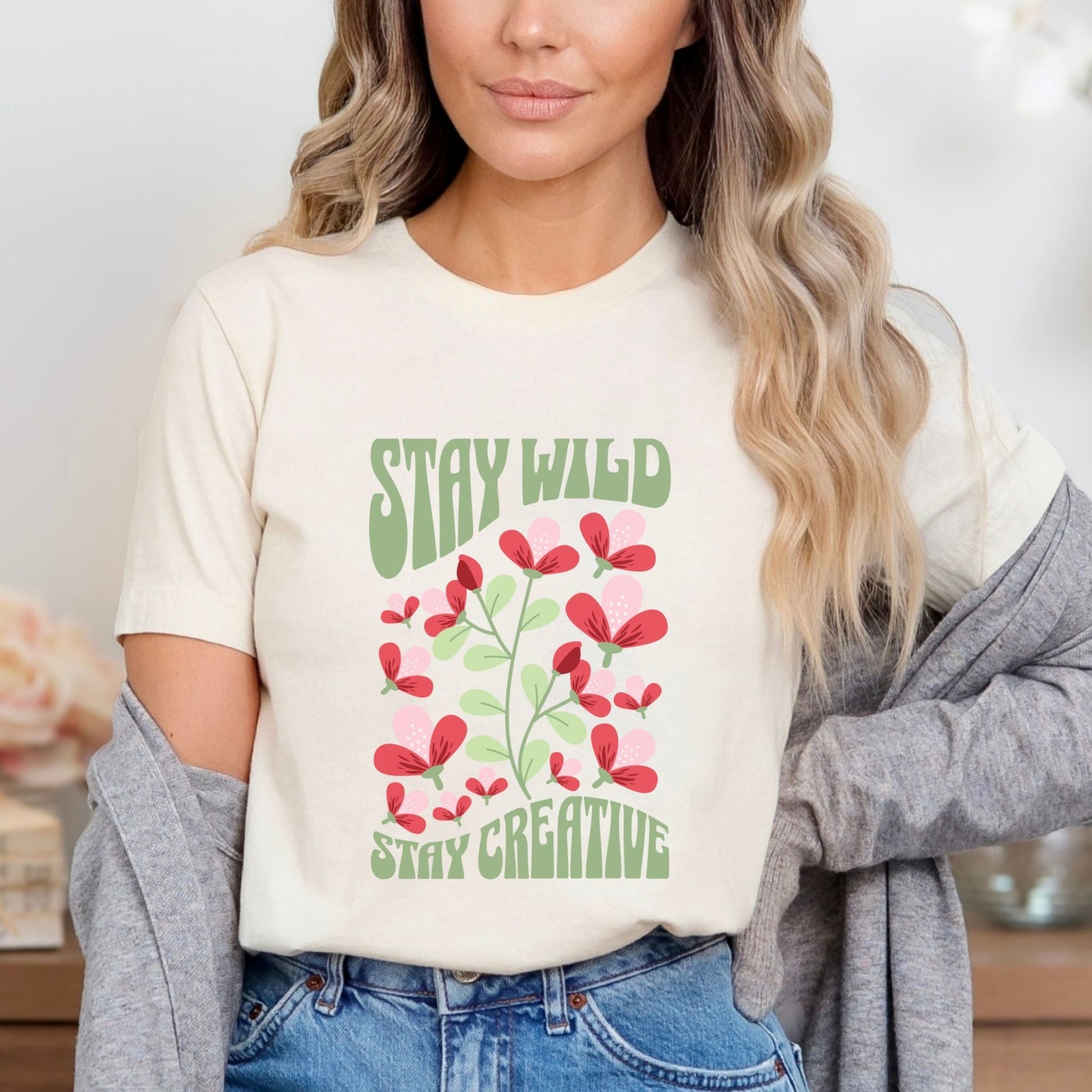 Stay Wild t-shirt with retro floral design and inspirational quote for creatives.