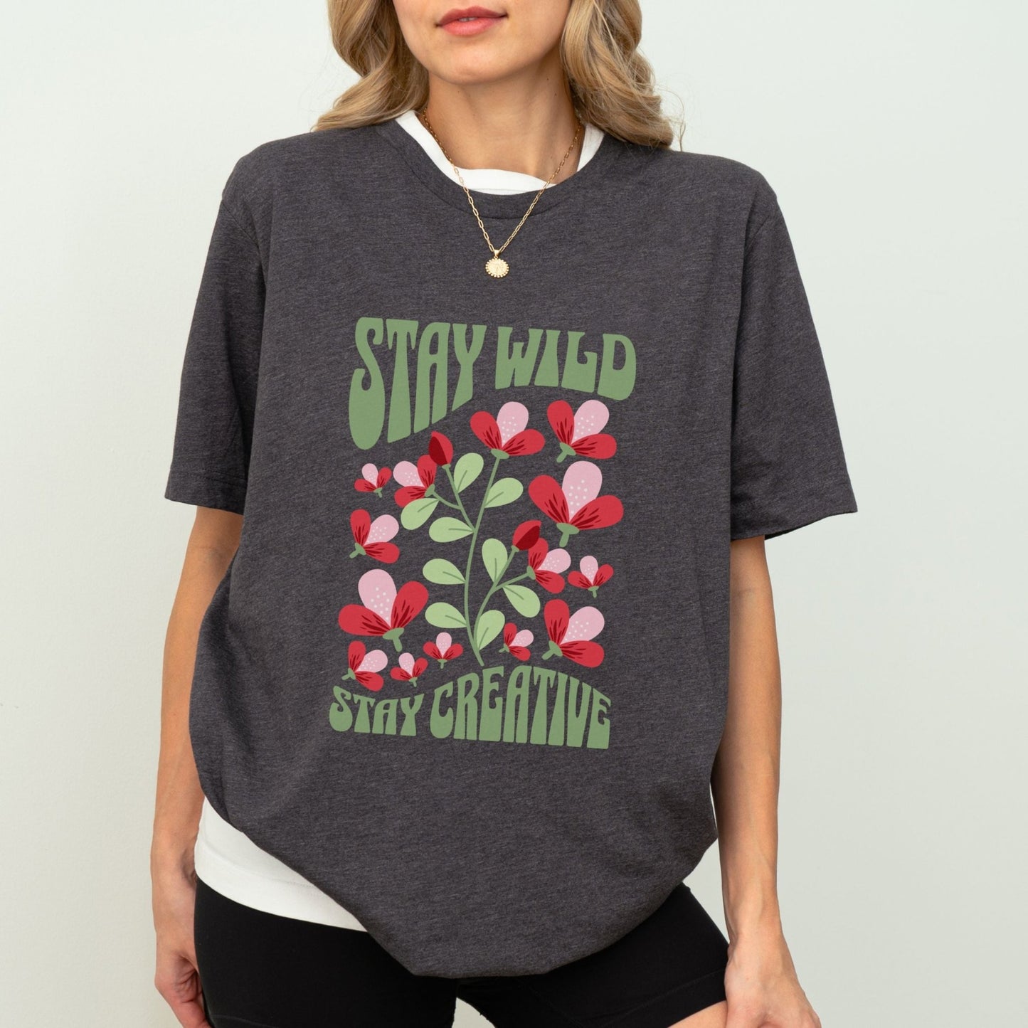 Stay Wild t-shirt with retro floral design and inspirational quote for creatives.