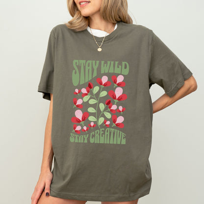 Stay Wild t-shirt with retro floral design and inspirational quote for creatives.