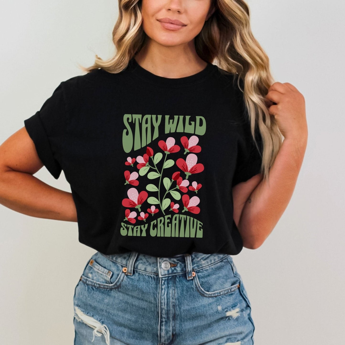 Stay Wild t-shirt with retro floral design and inspirational quote for creatives.