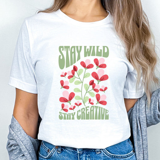 Stay Wild t-shirt with retro floral design and inspirational quote for creatives.