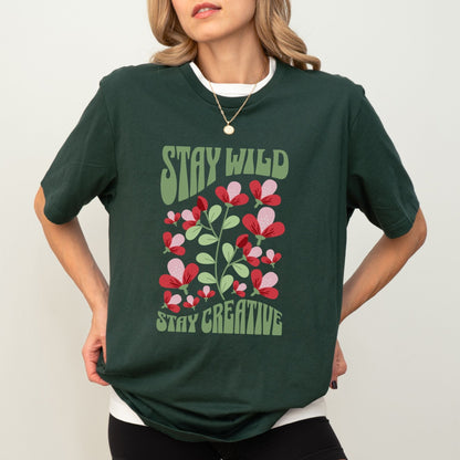 Stay Wild t-shirt with retro floral design and inspirational quote for creatives.