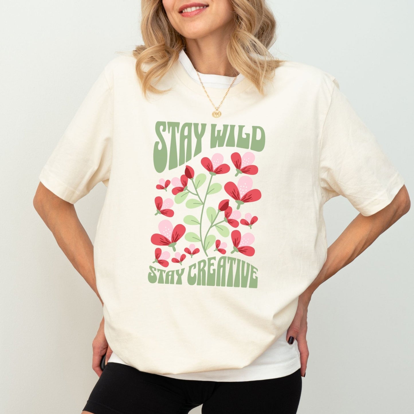 Stay Wild t-shirt with retro floral design and inspirational quote for creatives.