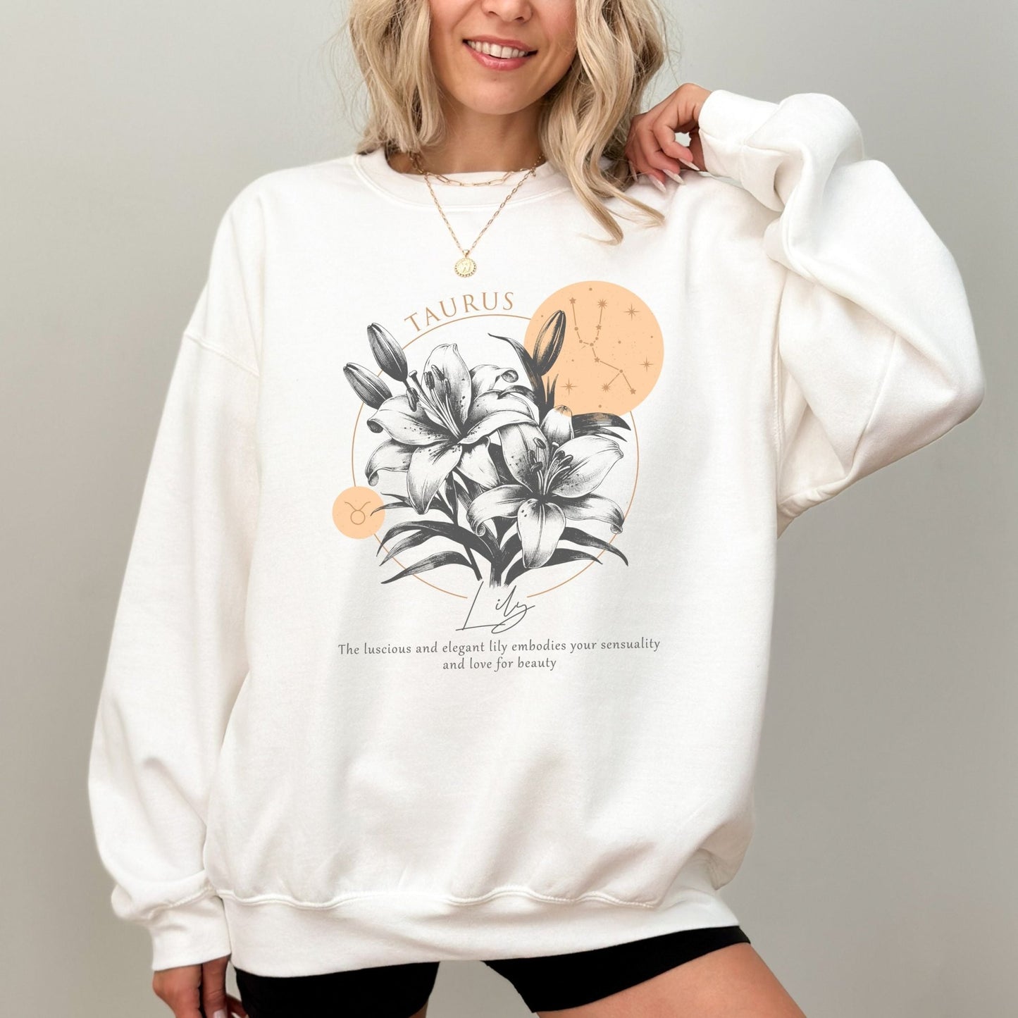 Taurus sweatshirt with lily flower design.