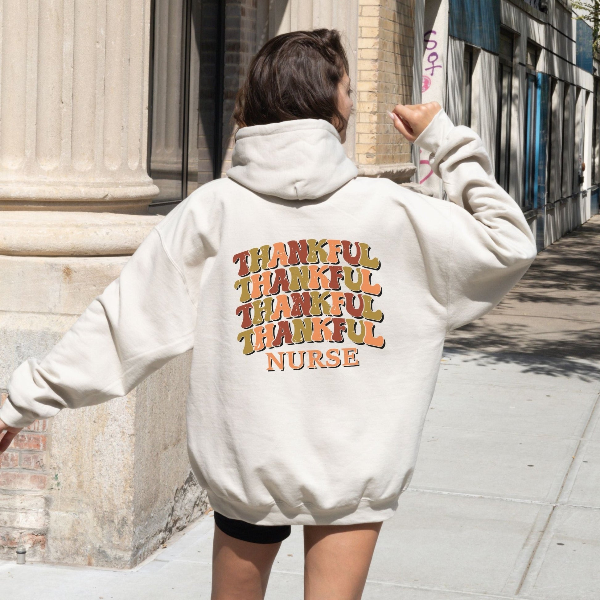 Thankful nurse hoodie with retro fall colors, perfect for Thanksgiving and healthcare workers.