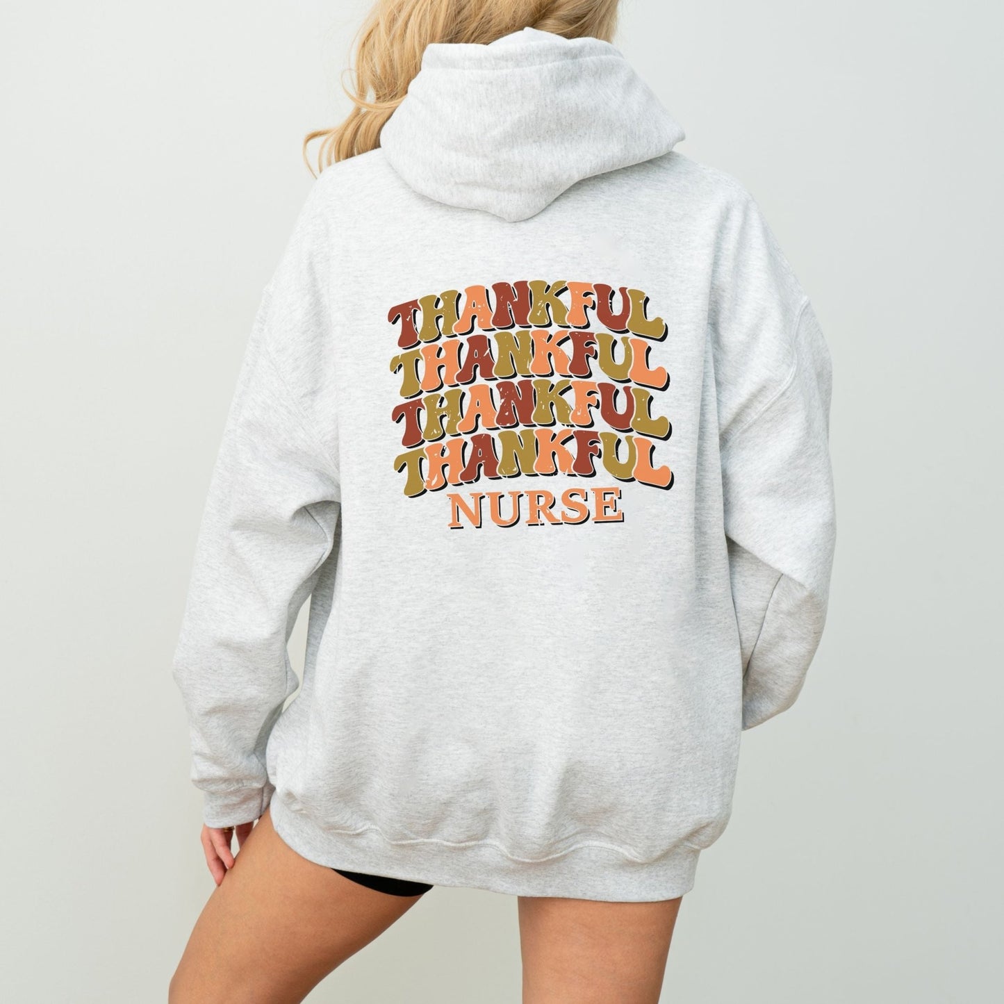 Thankful nurse hoodie with retro fall colors, perfect for Thanksgiving and healthcare workers.