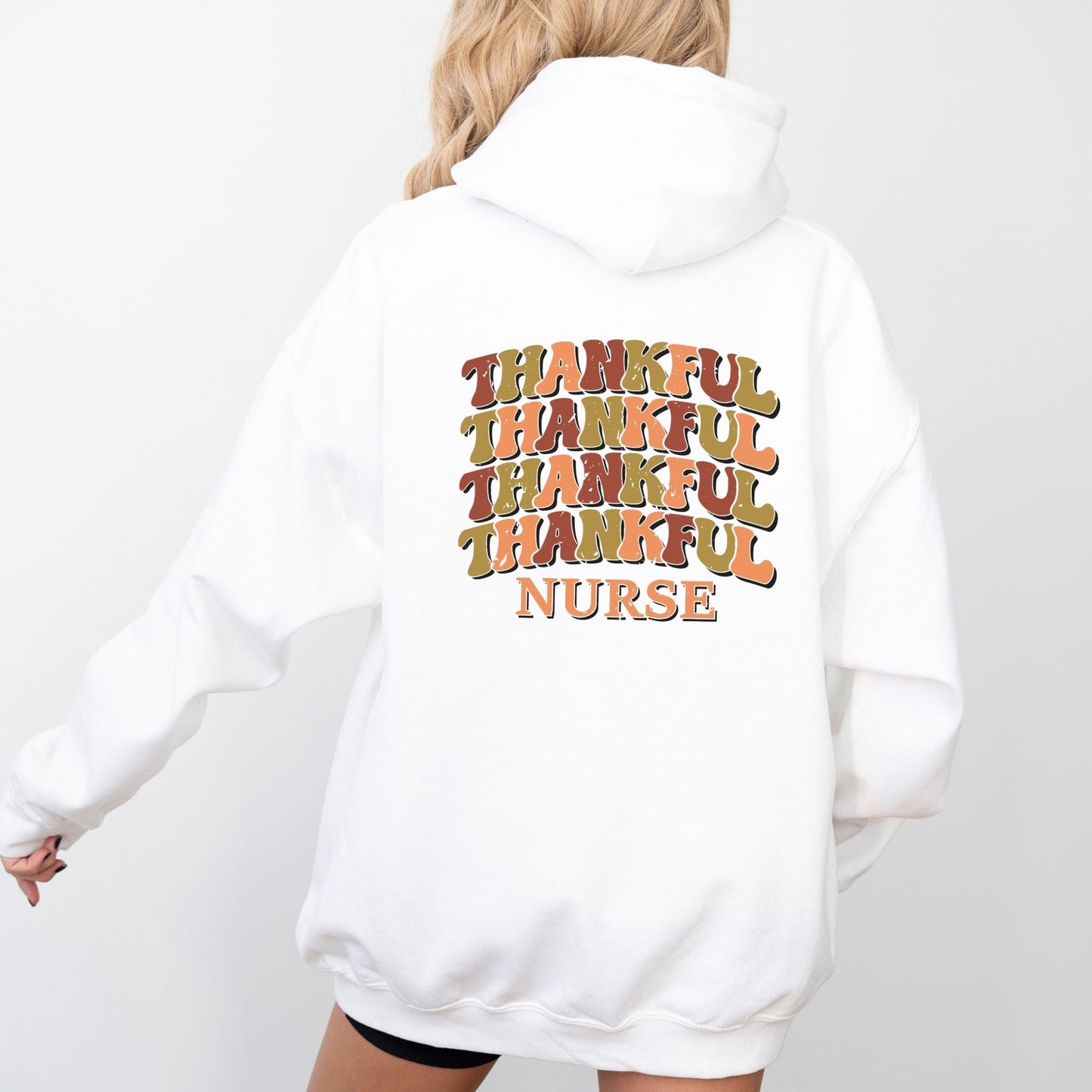 Thankful nurse hoodie with retro fall colors, perfect for Thanksgiving and healthcare workers.