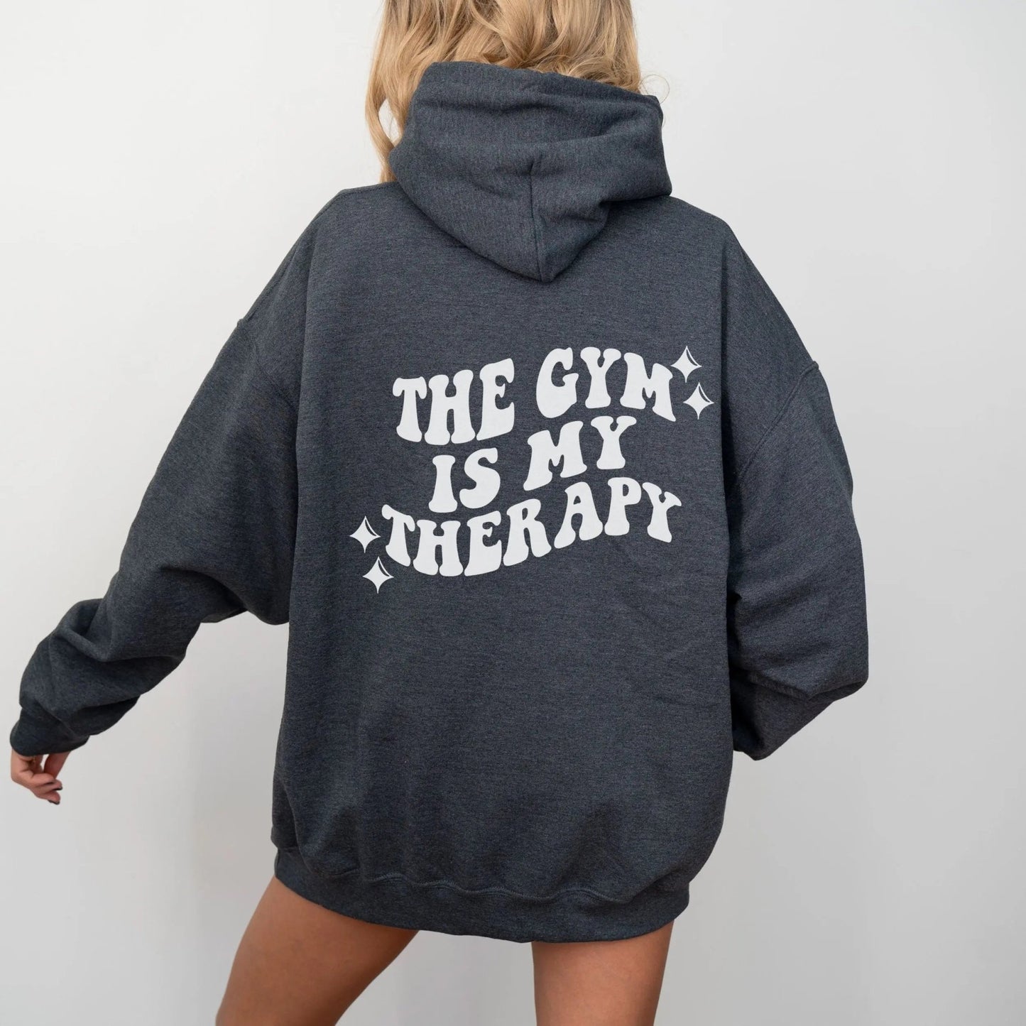 "The Gym is My Therapy" hoodie from That Cozy Vibe, available in 10 colors, fitness motivation.