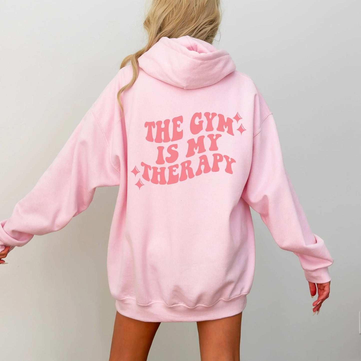 "The Gym is My Therapy" hoodie from That Cozy Vibe, available in 10 colors, fitness motivation.