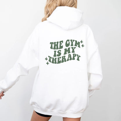 "The Gym is My Therapy" hoodie from That Cozy Vibe, available in 10 colors, fitness motivation.