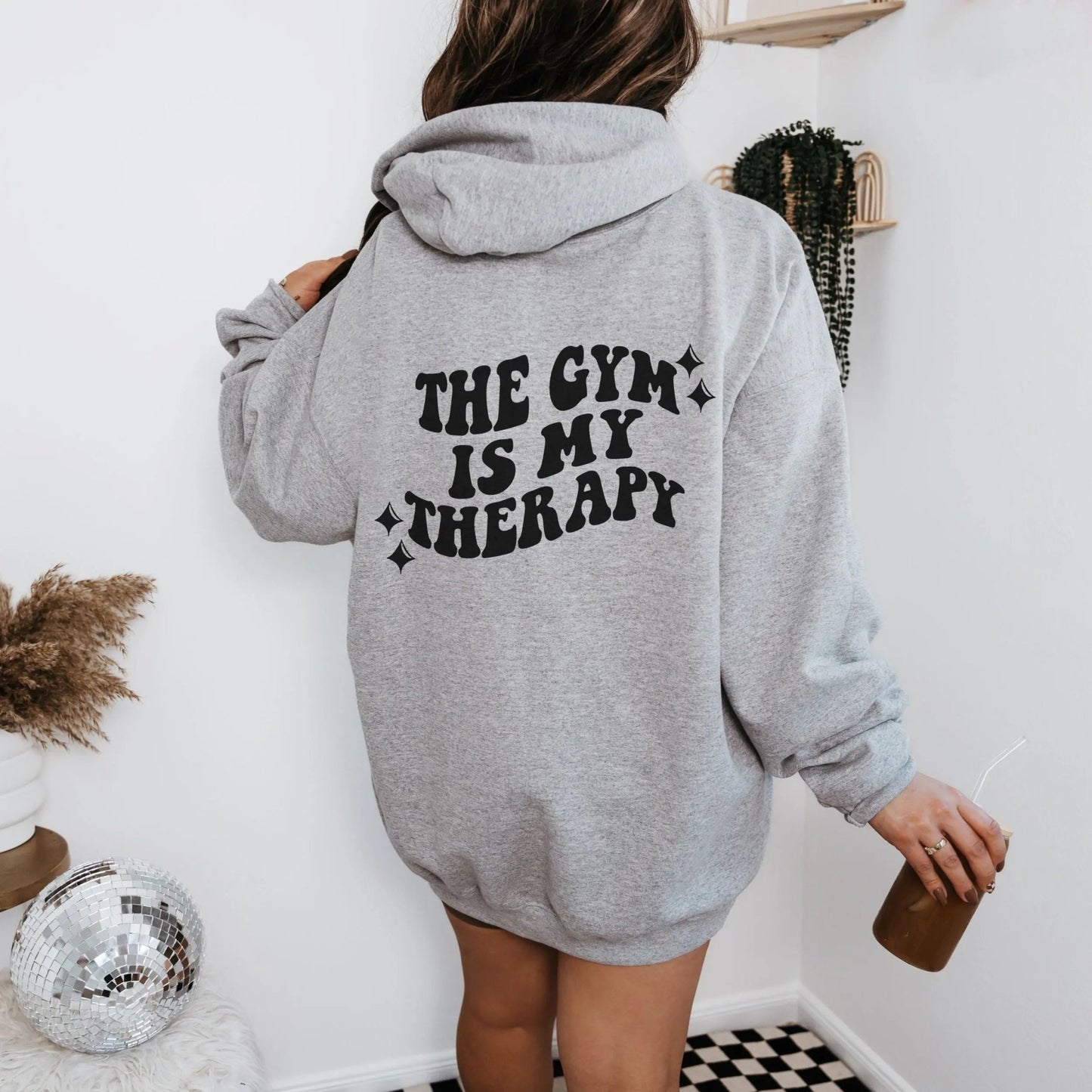 "The Gym is My Therapy" hoodie from That Cozy Vibe, available in 10 colors, fitness motivation.