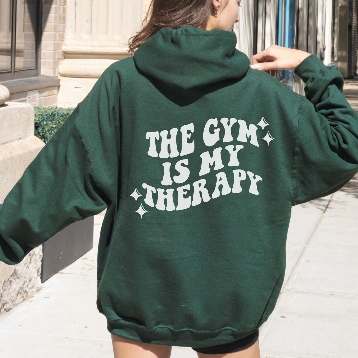 "The Gym is My Therapy" hoodie from That Cozy Vibe, available in 10 colors, fitness motivation.