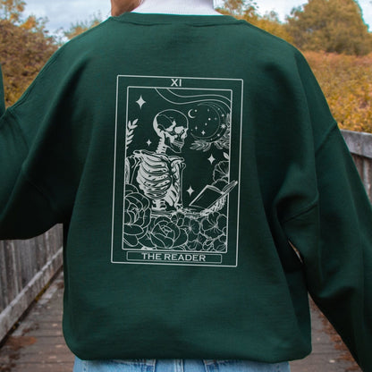 “The Reader Tarot” sweatshirt with mystical tarot card illustration printed on the back, perfect for book lovers and cozy fall vibes.
