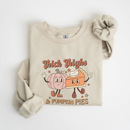 Thanksgiving sweatshirt with "Thick Thighs & Pumpkin Pies" graphic featuring pumpkin and pie characters.