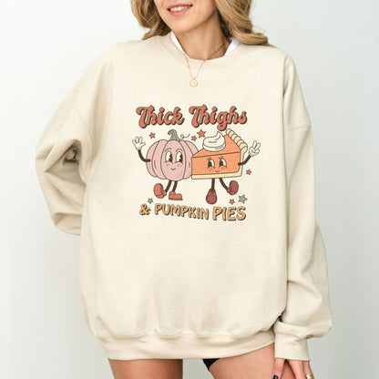 Thanksgiving sweatshirt with "Thick Thighs & Pumpkin Pies" graphic featuring pumpkin and pie characters.