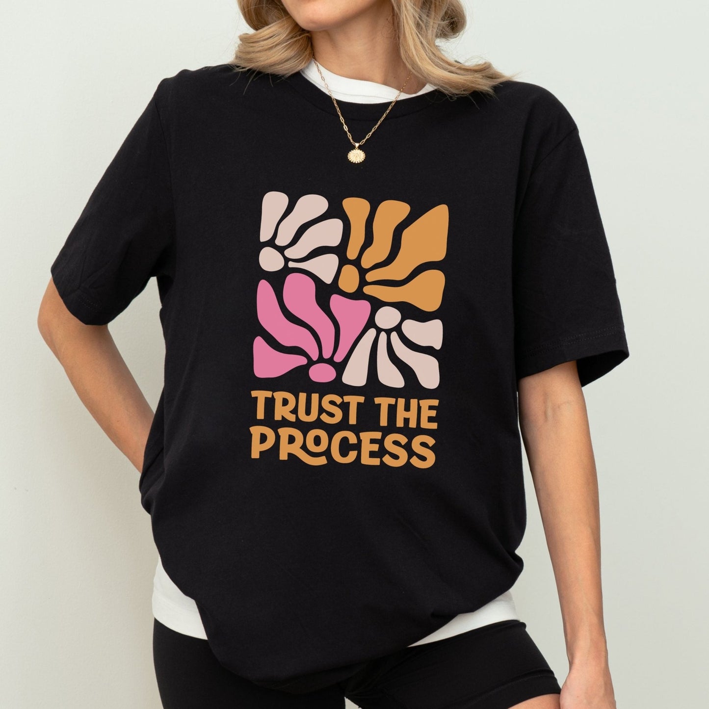 Trust the Process t-shirt with a vibrant floral abstract design in bold colors, perfect for motivation and style.