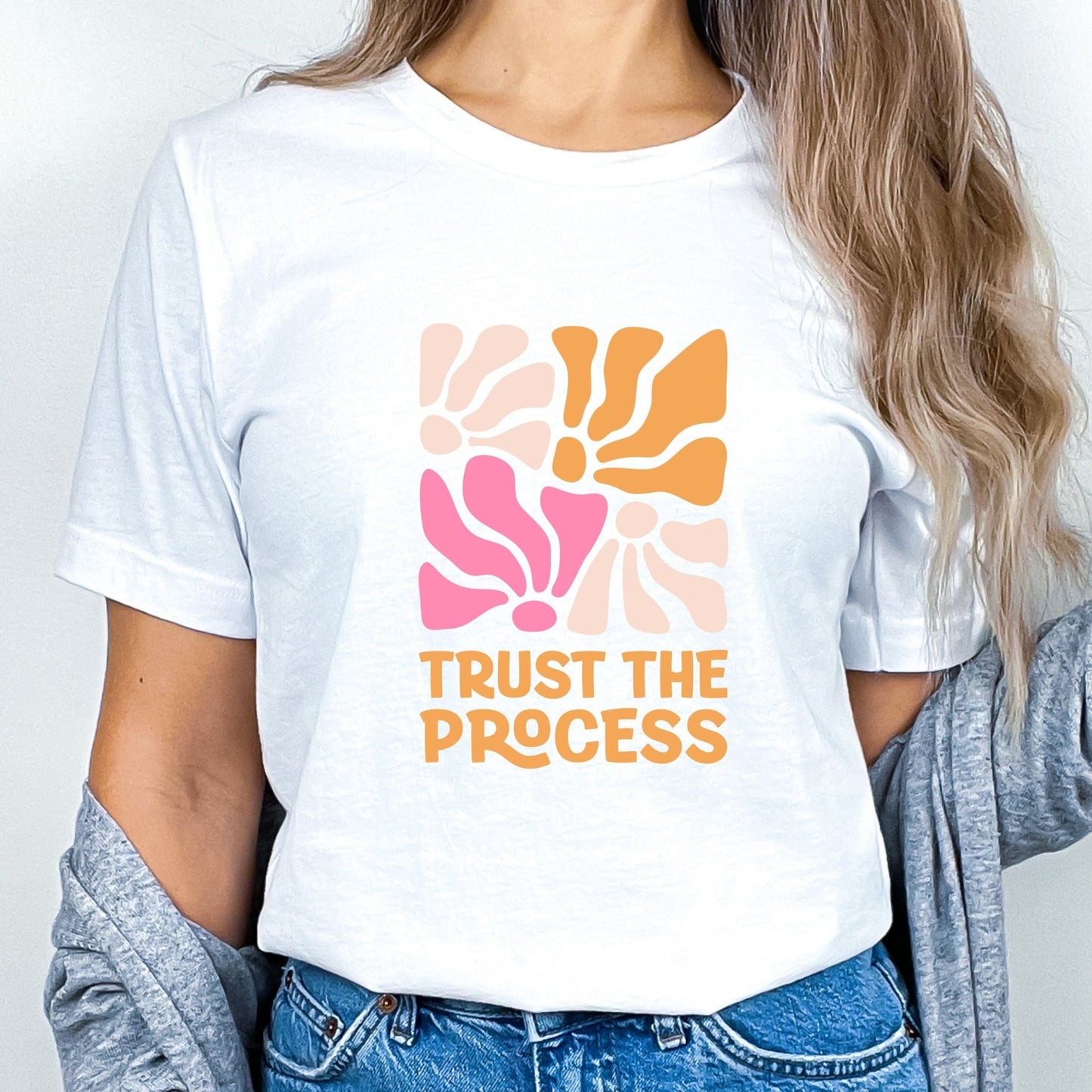 Trust the Process t-shirt with a vibrant floral abstract design in bold colors, perfect for motivation and style.