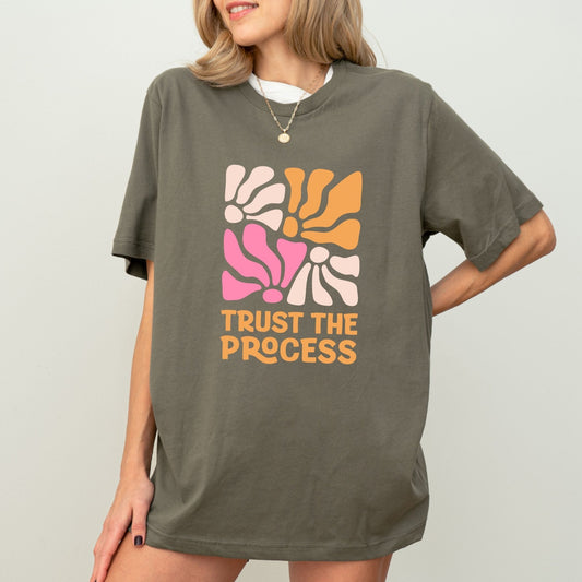 Trust the Process t-shirt with a vibrant floral abstract design in bold colors, perfect for motivation and style.