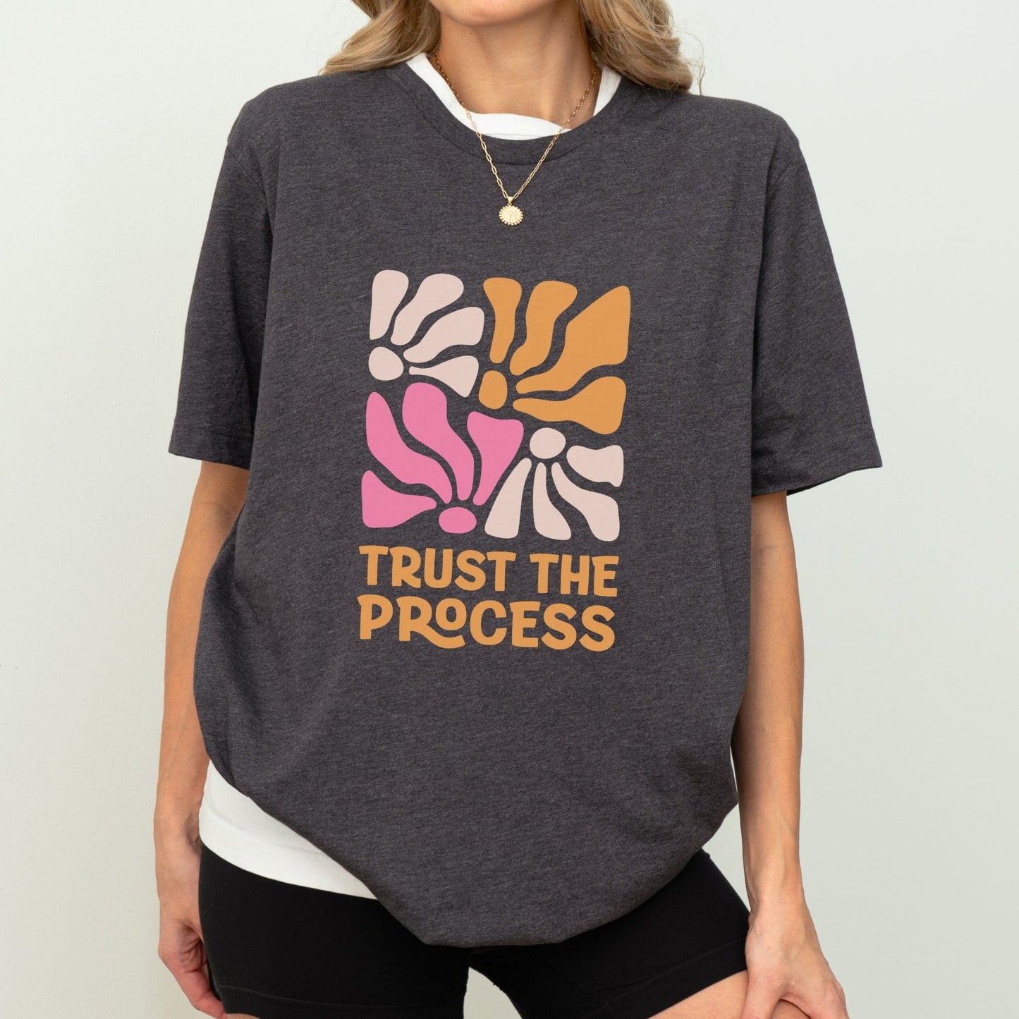 Trust the Process t-shirt with a vibrant floral abstract design in bold colors, perfect for motivation and style.