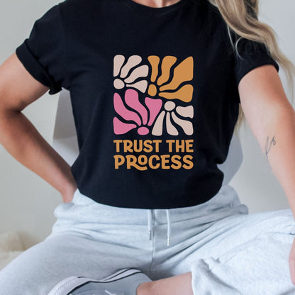 Trust the Process t-shirt with a vibrant floral abstract design in bold colors, perfect for motivation and style.