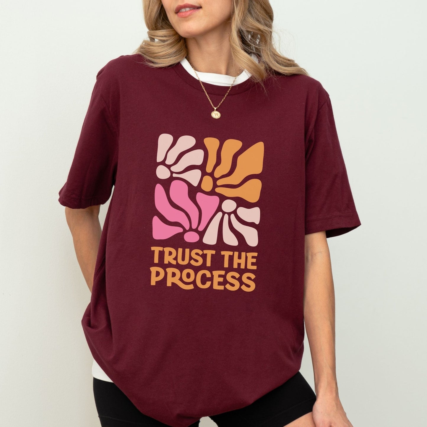 Trust the Process t-shirt with a vibrant floral abstract design in bold colors, perfect for motivation and style.