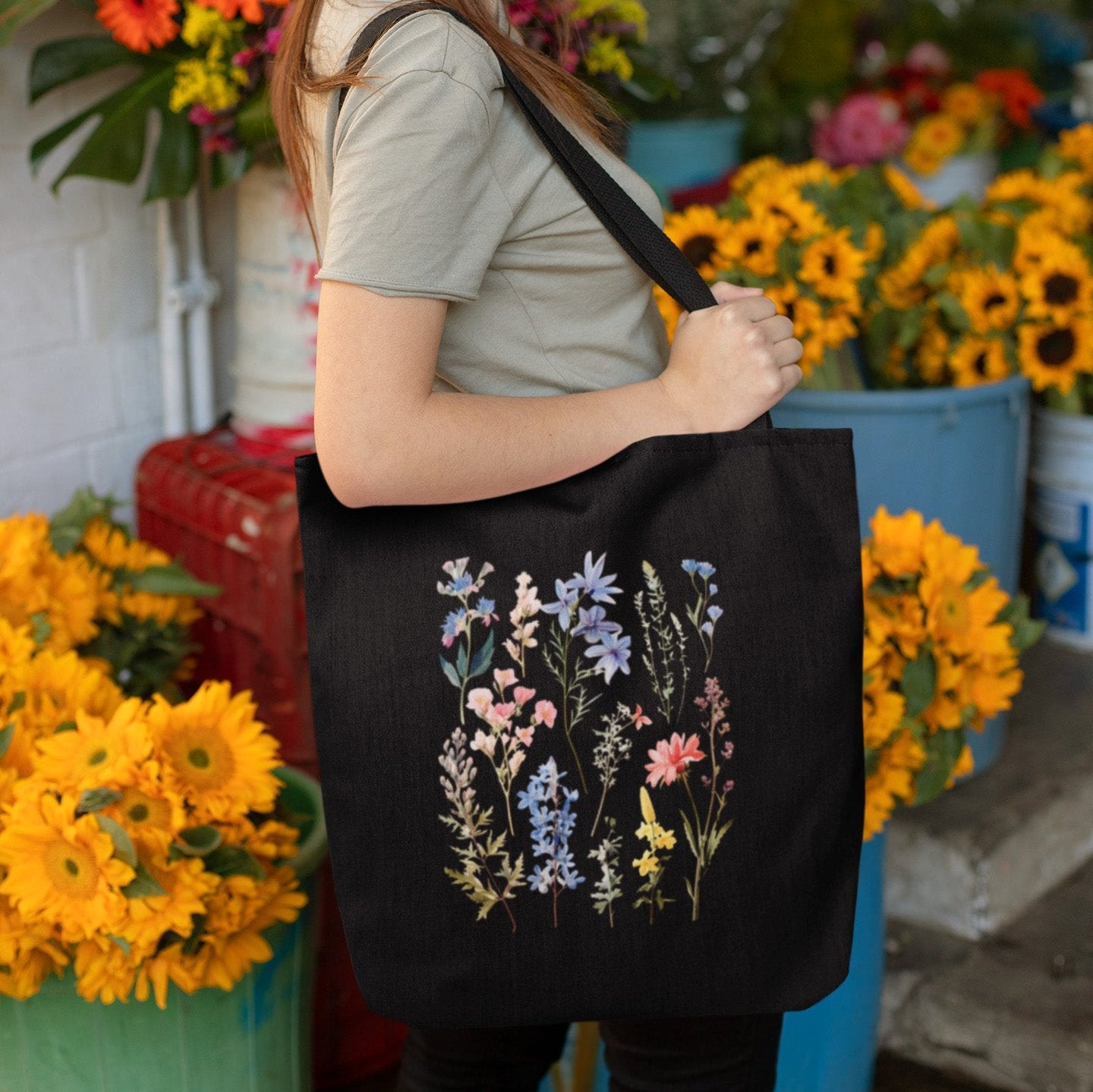 Wildflower boho tote bag with floral design, available in natural and black.