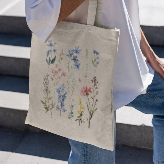 Wildflower boho tote bag with floral design, available in natural and black.