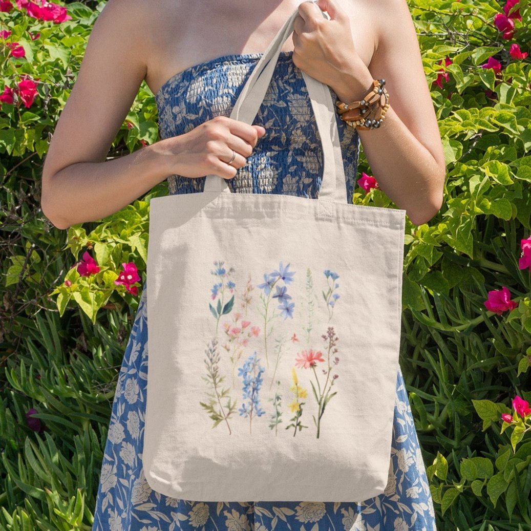 Wildflower boho tote bag with floral design, available in natural and black.