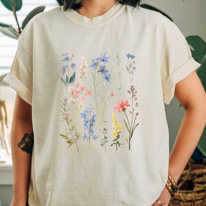 "Vintage Wildflower" shirt with botanical design, 100% cotton, available in 6 colors.