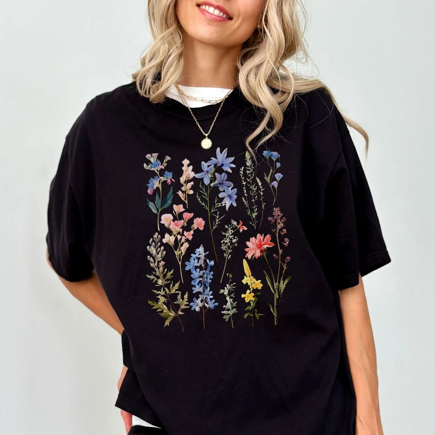 "Vintage Wildflower" shirt with botanical design, 100% cotton, available in 6 colors.